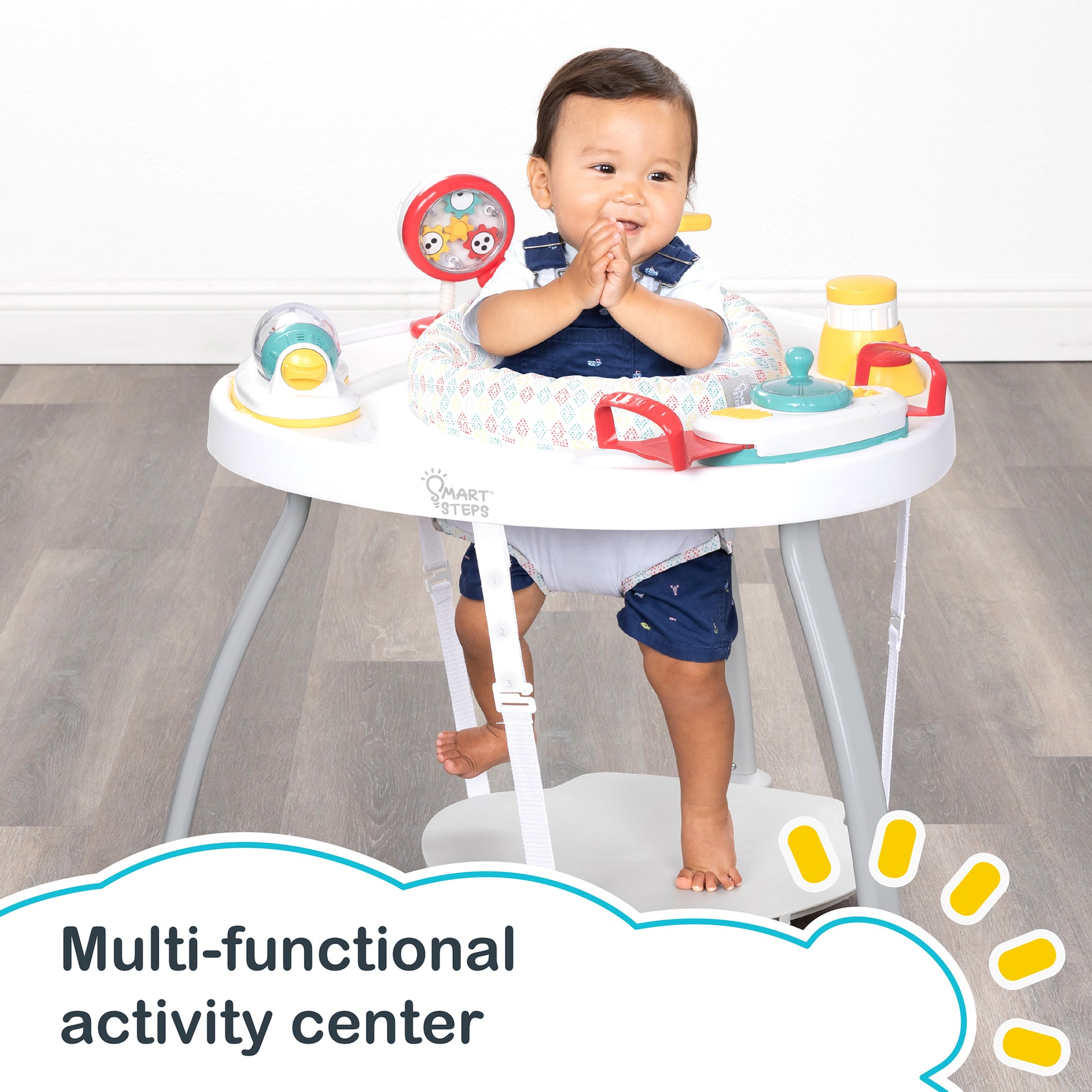 A child is having fun sitting in the Smart Steps Hop N' Discover 3-in-1 Activity Center