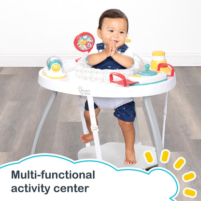 A child is having fun sitting in the Smart Steps Hop N' Discover 3-in-1 Activity Center